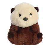 A brown sea otter plush toy from the Rolly Pet collection by Aurora with a cream face and rosy cheeks.